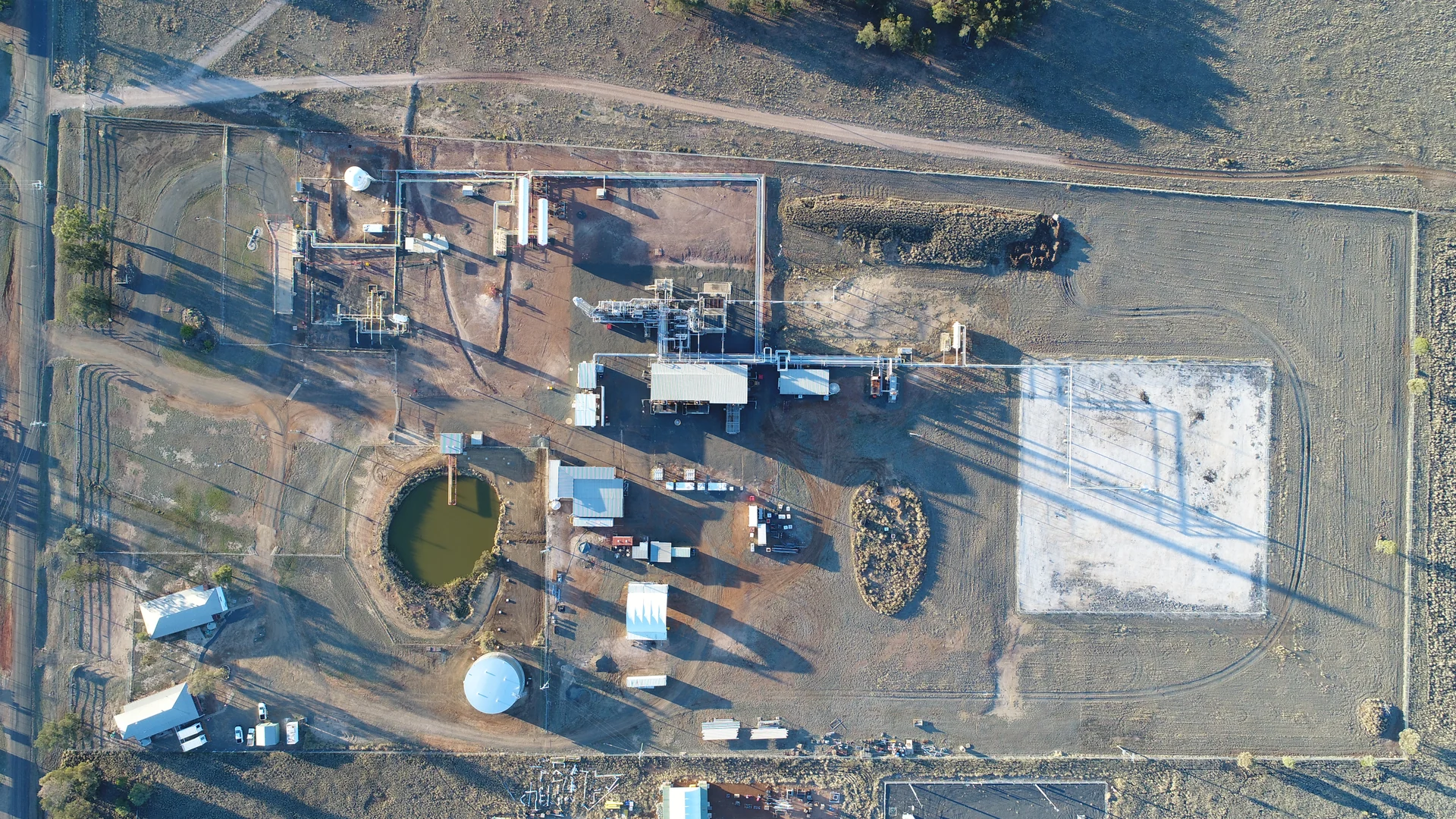 Aerial view of an industrial process plant, pipework and storage areas